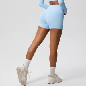 Detail of light blue high-waisted yoga shorts with butt-lifting and slimming seams