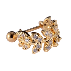 Macro view of gold leaf stud earring with clear crystals and threaded ball back