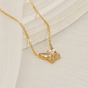 Luxurious gold butterfly pendant necklace with zircon crystals on a fine chain