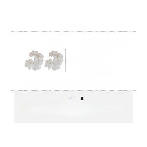 Detailed view of white lace flower earrings with crystal accents and 45mm C-shape design