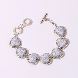 Detailed view of retro silver heart bracelet with white turquoise and toggle clasp closure