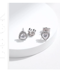 Detailed macro view of S925 sterling silver heart-shaped halo moissanite stud earrings