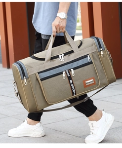 Outdoor street style view of a khaki canvas large travel bag with durable shoulder straps