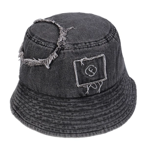 Distressed denim bucket hat with letter F patch and frayed ring detailing in dark grey
