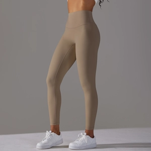 Detail view of khaki high-waisted yoga leggings showing the seamless wide waistband and fit