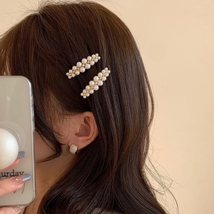 Elegant side hair clip set with white pearls on gold metal base for women