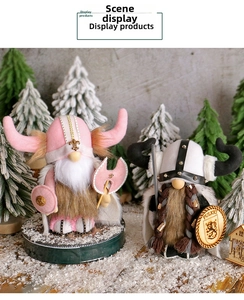 Detailed view of Viking gnome figurines with axes and shields in a winter snow setting