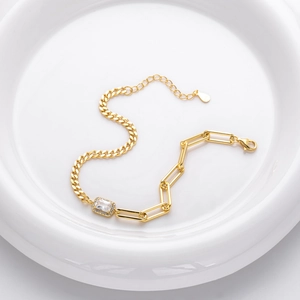 Elegant gold S925 sterling silver bracelet with square zircon on white ceramic plate