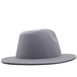 Detail shot of mid-grey fedora hat with smooth wool felt texture and fine brim stitching