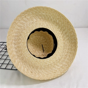 French style straw sun hat with black ribbon strap and wide brim for summer beach sun protection