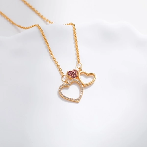 Exquisite 18K gold plated necklace featuring a triple heart pendant with sparkling zircons