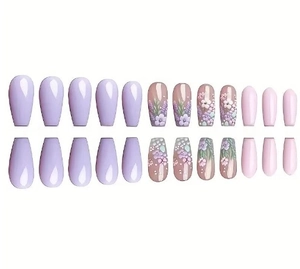 Close-up of 24 press-on nails featuring purple floral patterns and long coffin shape
