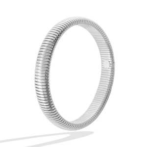 Detail of high-polish silver titanium steel Tubogas elastic cuff bracelet texture