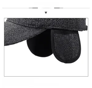 Close-up of thick grey wool winter hat earflap detail for extra warmth and protection