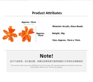 Macro detail of large orange acrylic flower earrings with sizing and 38g weight specs