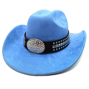 Close-up of blue faux suede cowboy hat featuring a black band with rhinestones and rivets