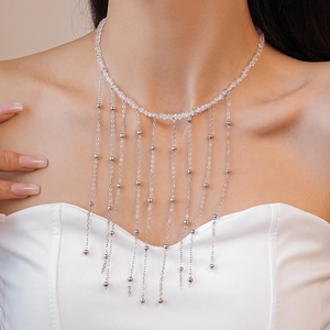 Elegant beaded choker necklace with long silver metallic tassels and crystal drops
