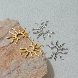 French vintage sunburst earrings in gold and silver finish with hammered metal texture