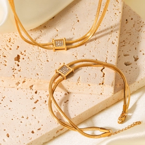 Double-layered gold snake chain necklace and bracelet set with square zircon pendant