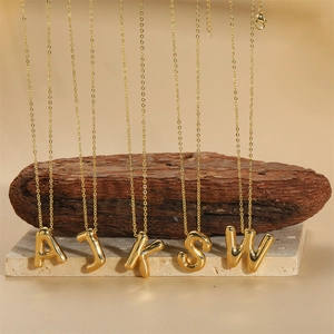 Golden 14K balloon initial pendant necklace for women with elegant gold finish
