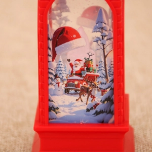 Detail of red Christmas lantern with festive Santa and reindeer snow scene illustration