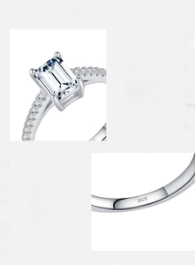 Macro detail of S925 hallmark on silver ring with emerald cut emerald cubic zirconia