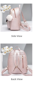 Detail view of pink PU leather backpack with white pompom charm and anti-theft back pocket
