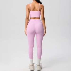 Rear view of pink seamless yoga set featuring thin strap bra and high waist leggings
