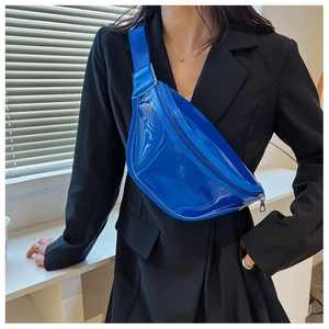 Close-up of vibrant blue PVC chest bag with adjustable strap and glossy mirror finish