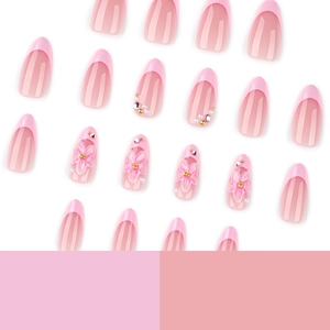 Short almond press-on nails with pink 3D flowers, pearls and French tip design