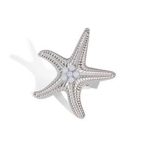 Detail of silver starfish ring featuring radial texture and six white pearl inlays