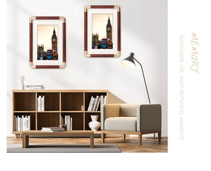 Detail of wooden picture frame with gold corner protectors and London city art print