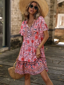Pink bohemian floral V-neck maxi dress with tiered skirt for a stylish summer vacation look