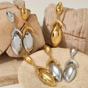 Minimalist geometric dangle earrings in polished gold and silver finish with stone display
