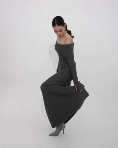 Detail of grey off-shoulder knit maxi dress showing ribbed texture and elegant fit
