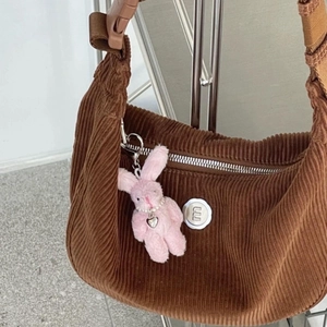 Brown corduroy dumpling shoulder bag with cute pink plush rabbit charm accessory