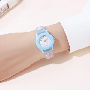 Close-up of child wearing blue butterfly cartoon watch with soft silicone strap