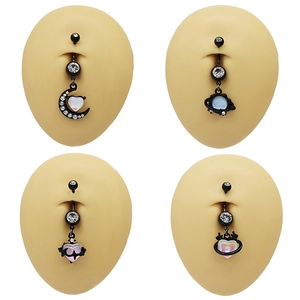 Set of 4 black moon and heart belly rings with iridescent stones on skin models
