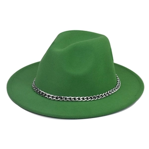 Macro view of bright green felt fedora hat featuring thick silver metal chain decoration