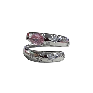 Minimalist open ring with pear-cut pink diamond and micro-set star accents on silver band