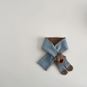 Detail of light blue knit scarf with brown trim and cute 3D bear ornament for toddlers