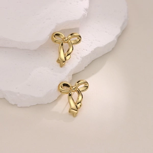 Irregular 18K gold plated stainless steel bow earrings with high-polish metallic finish