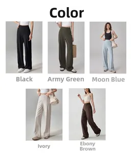 Détail du pantalon de yoga taille haute en noir, vert, bleu, ivoire et marron ébène