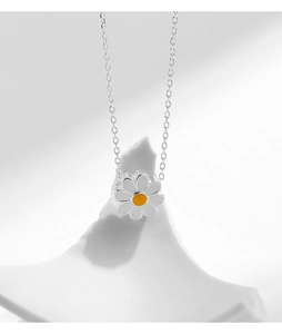 Close-up detail of S925 sterling silver daisy pendant with white enamel petals