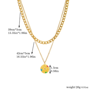 Double-layered gold evil eye pendant necklace with Cuban chain and size measurements