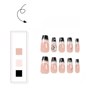 Macro detail of nude and black gradient press-on nails with heart rhinestones and stars