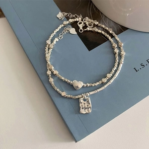 Double-layered sterling silver bracelet with heart pendant and engraved rectangular tag