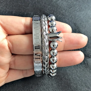 Three-piece silver stainless steel bracelet set with Roman numerals and crown charm