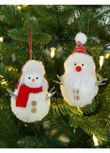 Detail of plush Santa and snowman ornaments with wood buttons on a Christmas tree