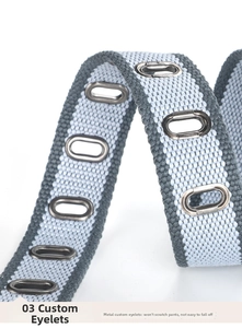 Detail of woven canvas belt showing customized metal eyelets with durable finish